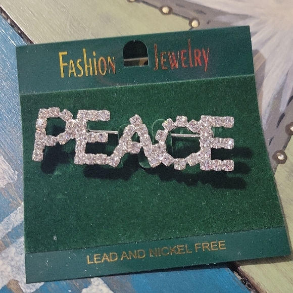 Jewelry - Rhinestone "PEACE" brooch - Silver Sparkle